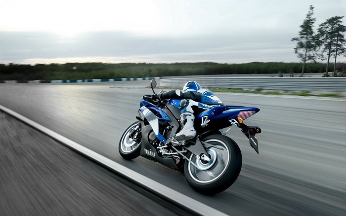 Yamaha R1 motorcycle racing on a track