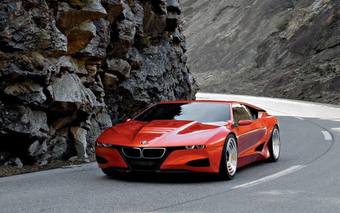Red BMW concept sports car on a mountain road