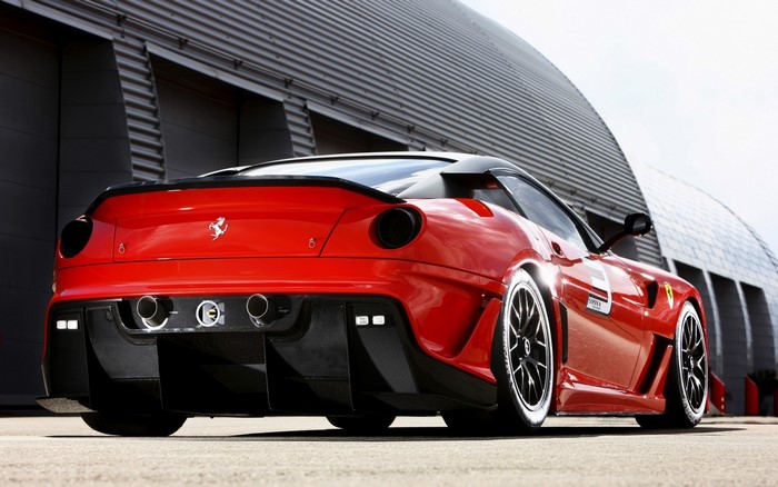 Red Ferrari sports car with black accents
