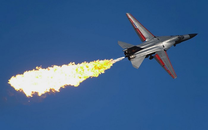 General Dynamics F-111 Aardvark jet aircraft performing aerobatics
