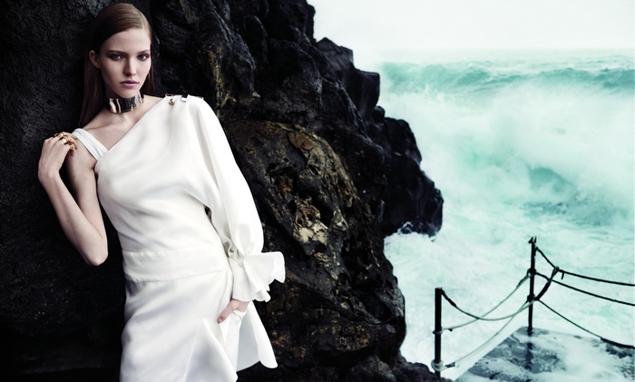 Sasha Luss in white dress by the sea