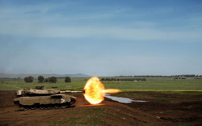 Merkava tank firing in a field
