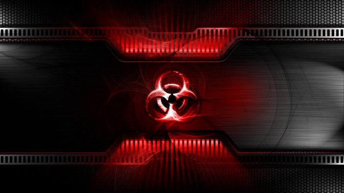 Biohazard symbol on a dark, metallic background with red accents