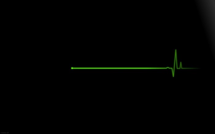 Green heartbeat line on black background