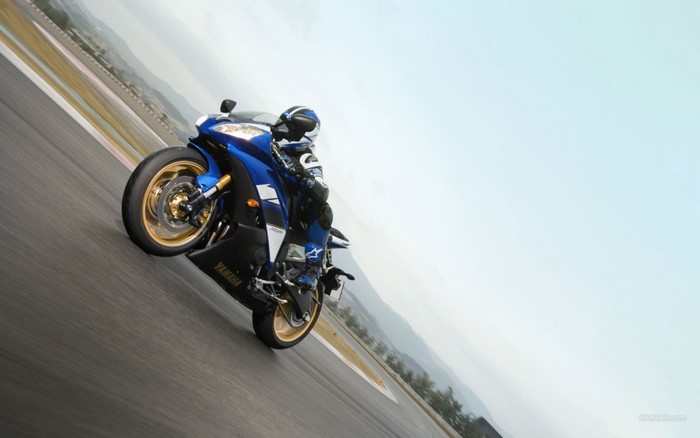 Yamaha R6 motorcycle rider on a race track