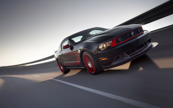 Black Ford Mustang Boss 302 Laguna Seca on a road