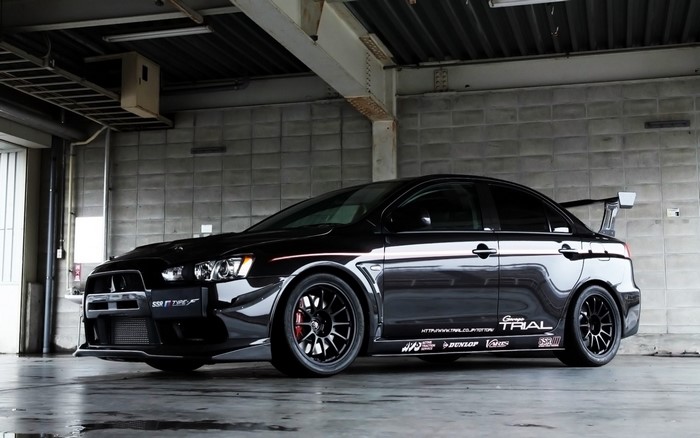 Black Mitsubishi Lancer Evolution with racing decals