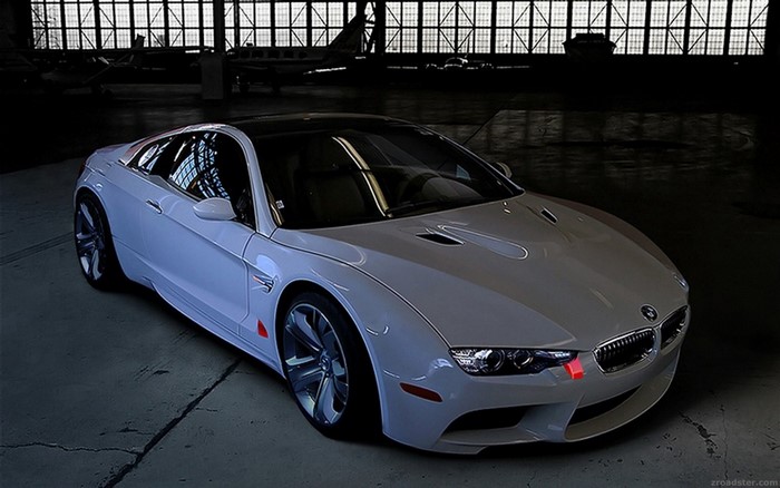 White BMW sports car in a hangar
