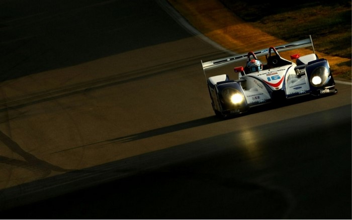Race car number 16 on a track