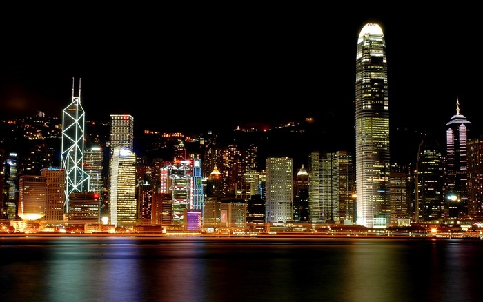 Hong Kong skyline at night with illuminated skyscrapers