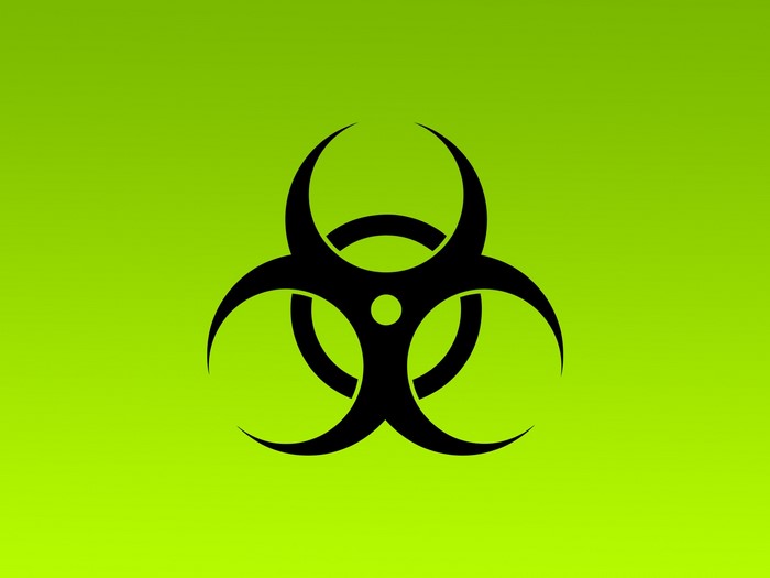 Black biohazard symbol on a green background