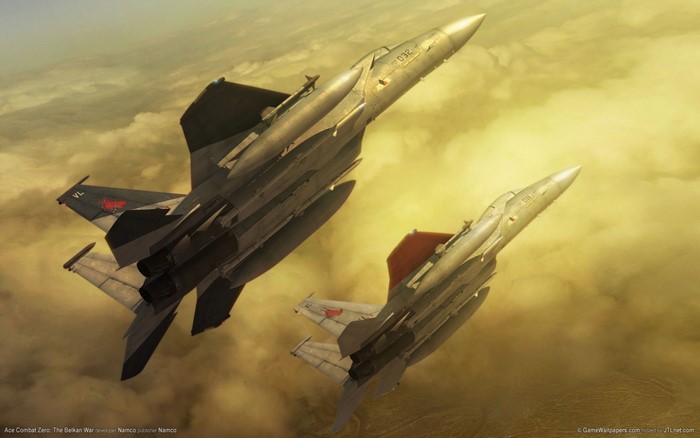 Two fighter jets flying in the sky