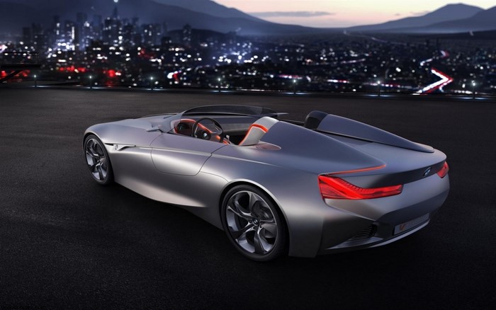 BMW concept sports car at night with city background