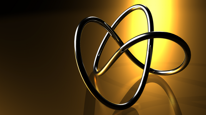 Abstract metallic knot on a yellow and brown background