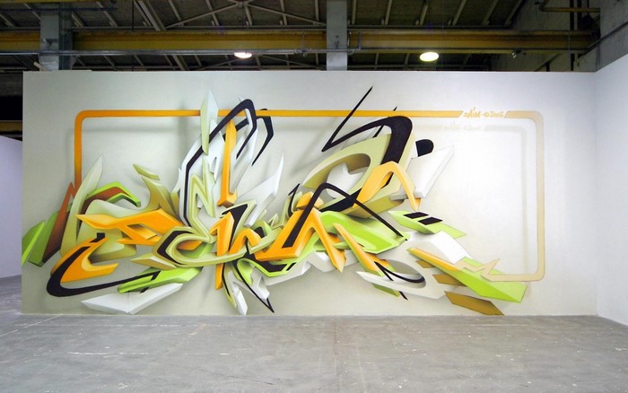 Graffiti art on a wall with orange frame