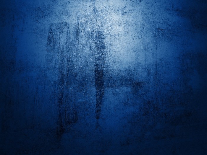 Blue textured surface with light reflection