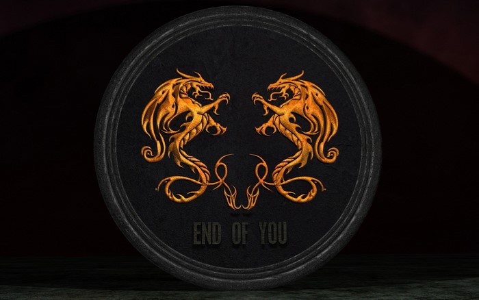Two golden dragons on a dark circular emblem with text