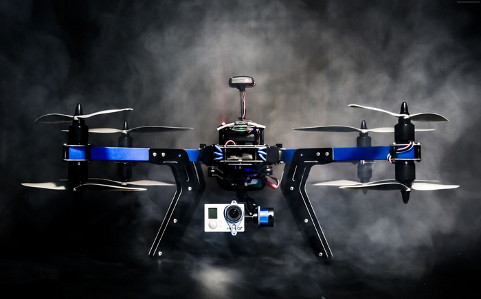 Drone with camera and propellers in smoke