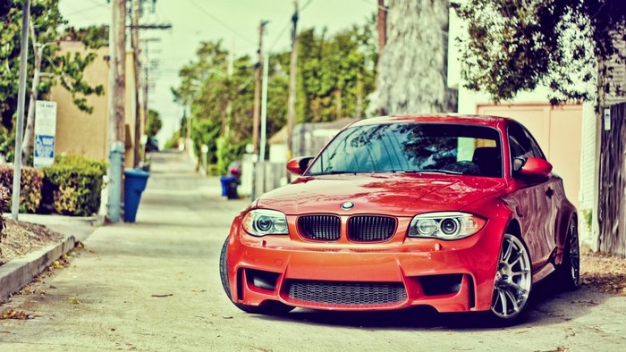 Red BMW 1 Series parked on a street