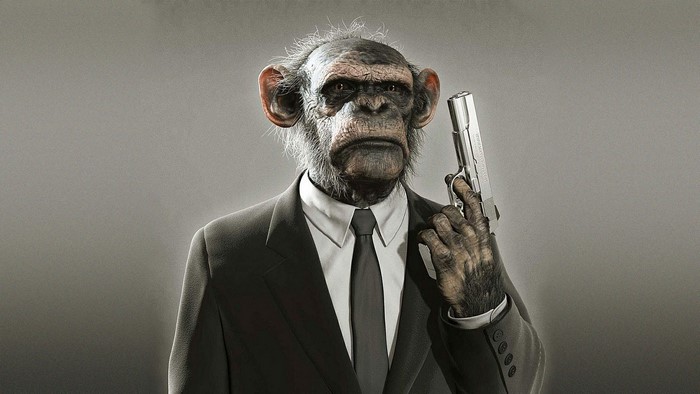 Chimpanzee in a suit holding a pistol