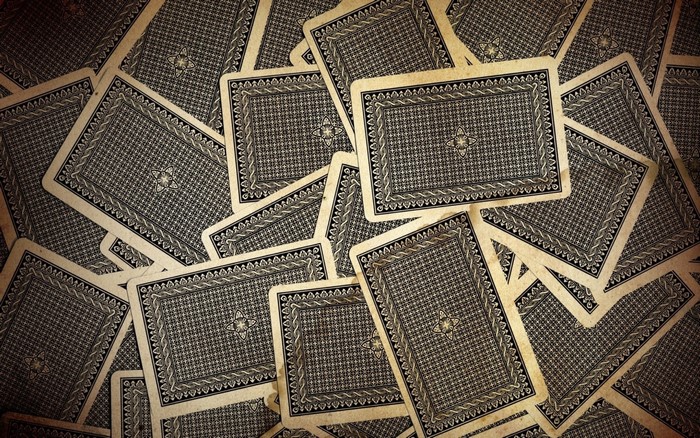Pile of playing cards with patterned backs