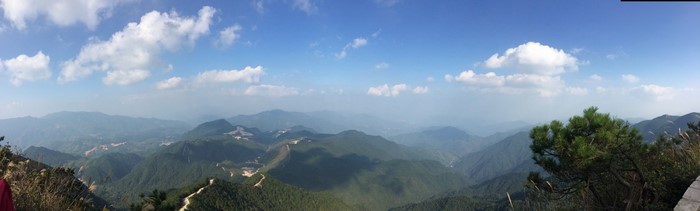 Panoramic view of mountains and valleys under a blue sky