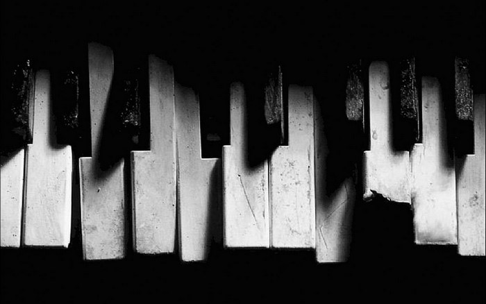 Close-up of broken piano keys in monochrome