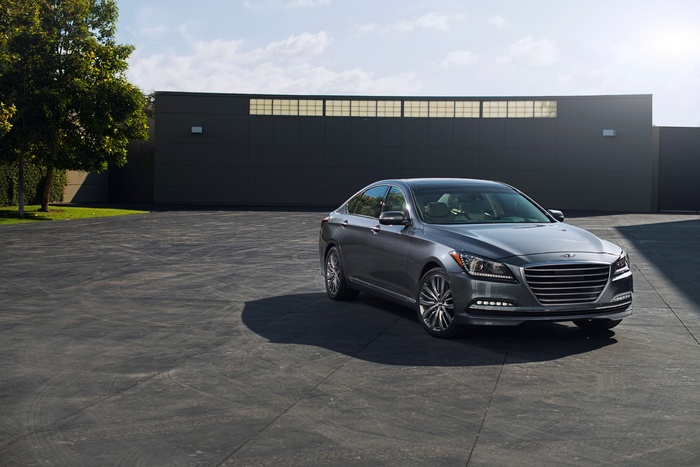 Gray Hyundai Genesis Sedan parked in front of a building