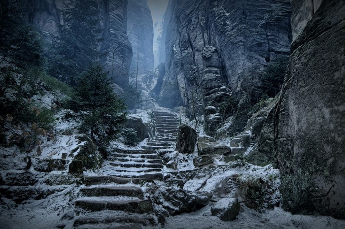 Stone stairs in a snowy mountain gorge