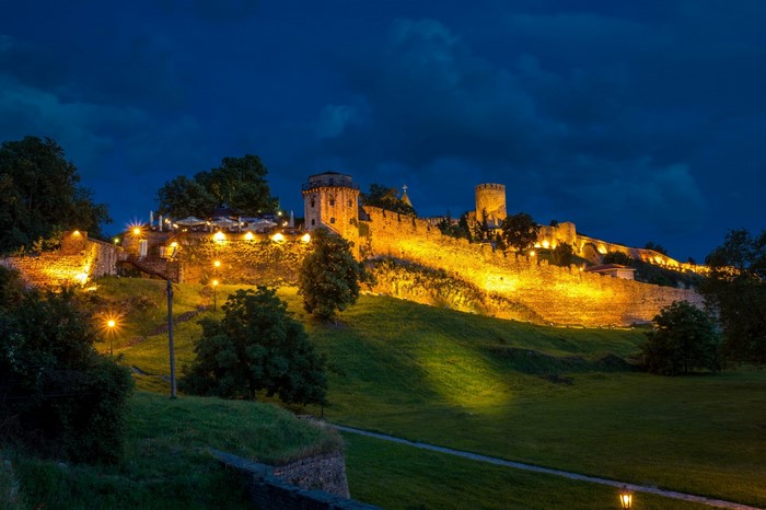 Belgrade Fortress at night with illuminated walls and towers
