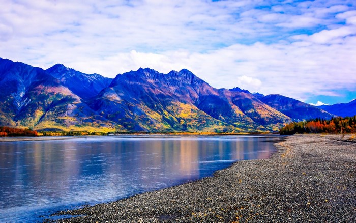 Mountain range reflected in a lake during autumn