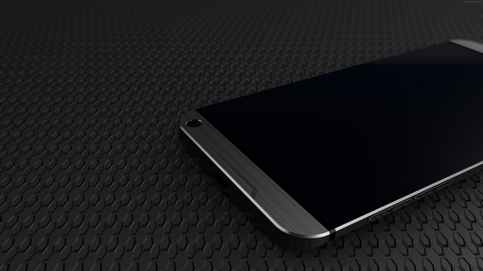 HTC One M10 smartphone on a black textured surface