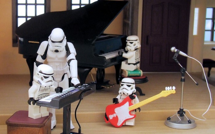 Stormtroopers playing musical instruments in a room