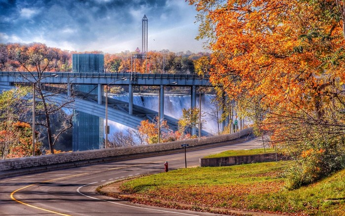 Autumn scene with bridge and waterfall
