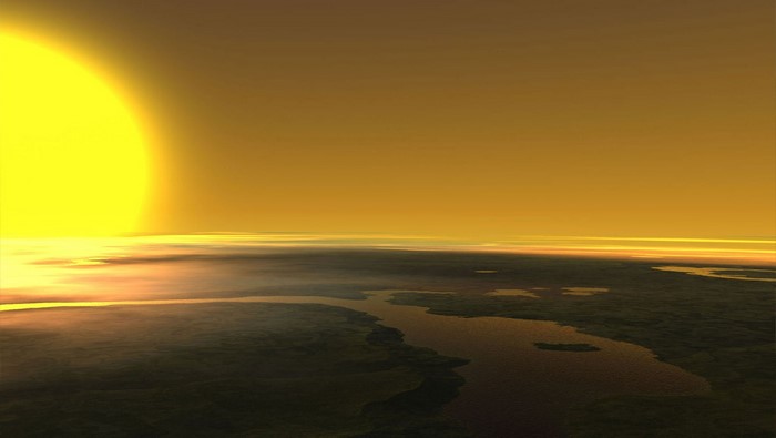 Planet with large sun and atmospheric haze over water