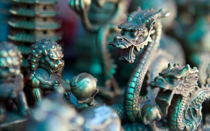 Close up of Chinese dragon and lion figurines