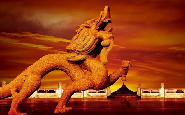Golden Chinese Dragon Statue at Sunset
