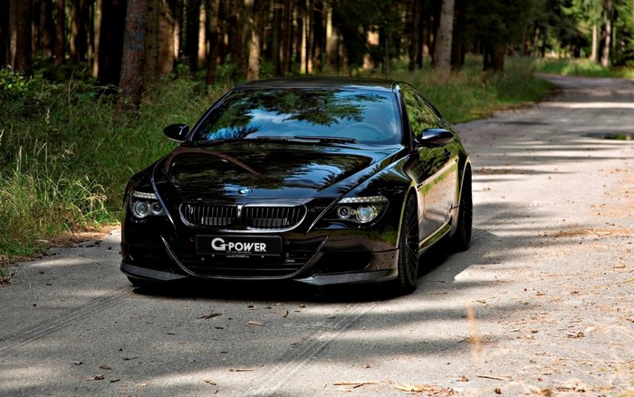 Black G-Power BMW M6 Coupe on a forest road