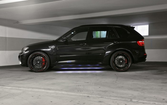 Black BMW X5M Typhoon with custom wheels and lighting
