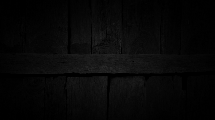 Dark wooden planks with a horizontal beam