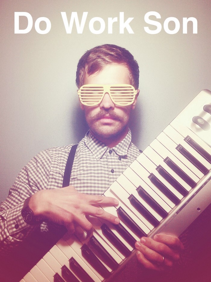 Man with shutter glasses plays a synthesizer