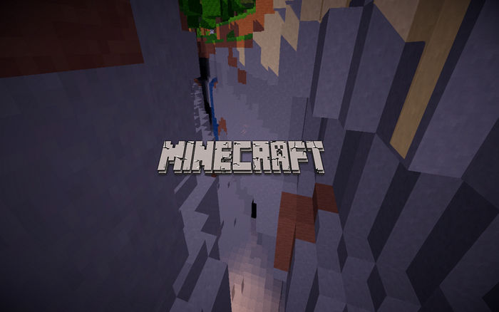 Minecraft logo over a canyon landscape