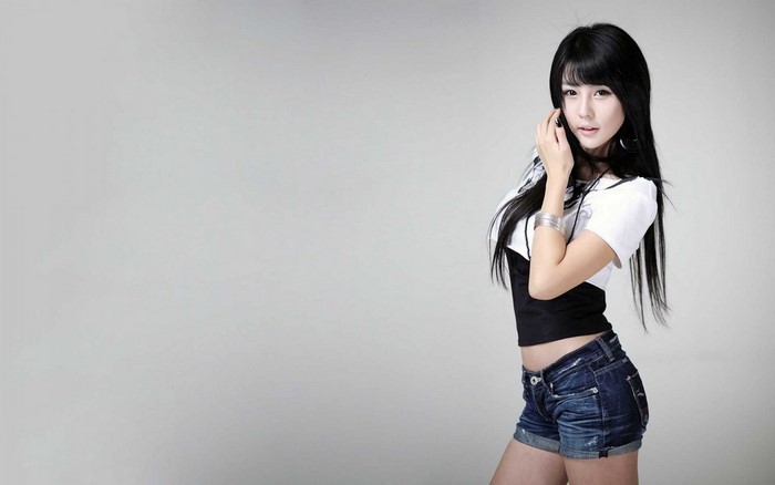 Asian woman with long black hair wearing shorts