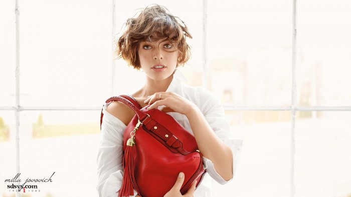Milla Jovovich with red handbag
