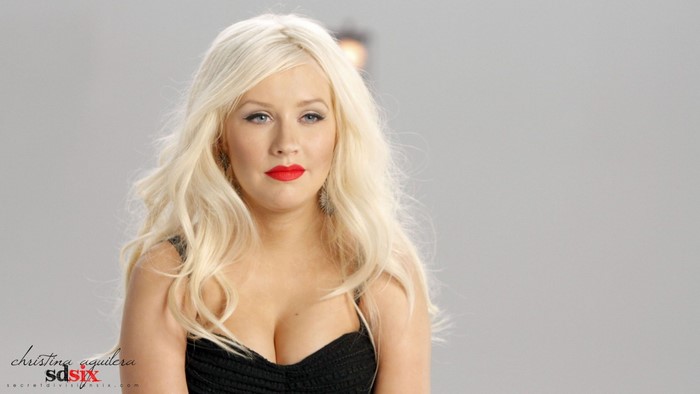 Christina Aguilera portrait with blonde hair and red lipstick