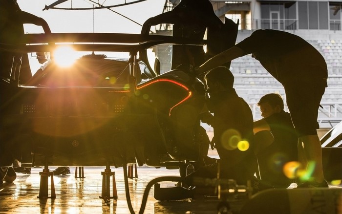 McLaren P1 GTR being worked on by mechanics