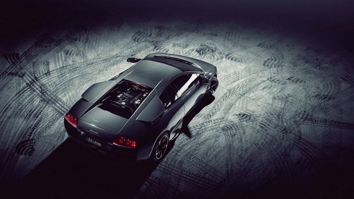 Black Lamborghini Murcielago LP640-4 on tire-marked ground
