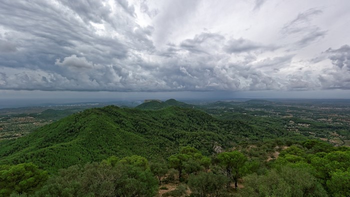 Panoramic view of green hills and cloudy sky over Mallorca