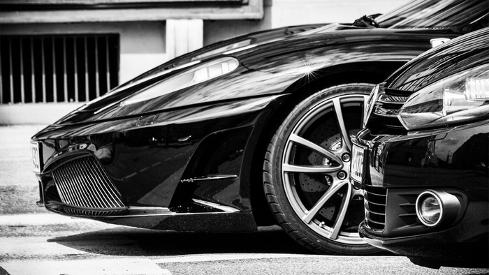 Black sports cars parked side-by-side
