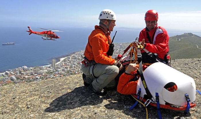 Mountain Rescue with Helicopter and City View